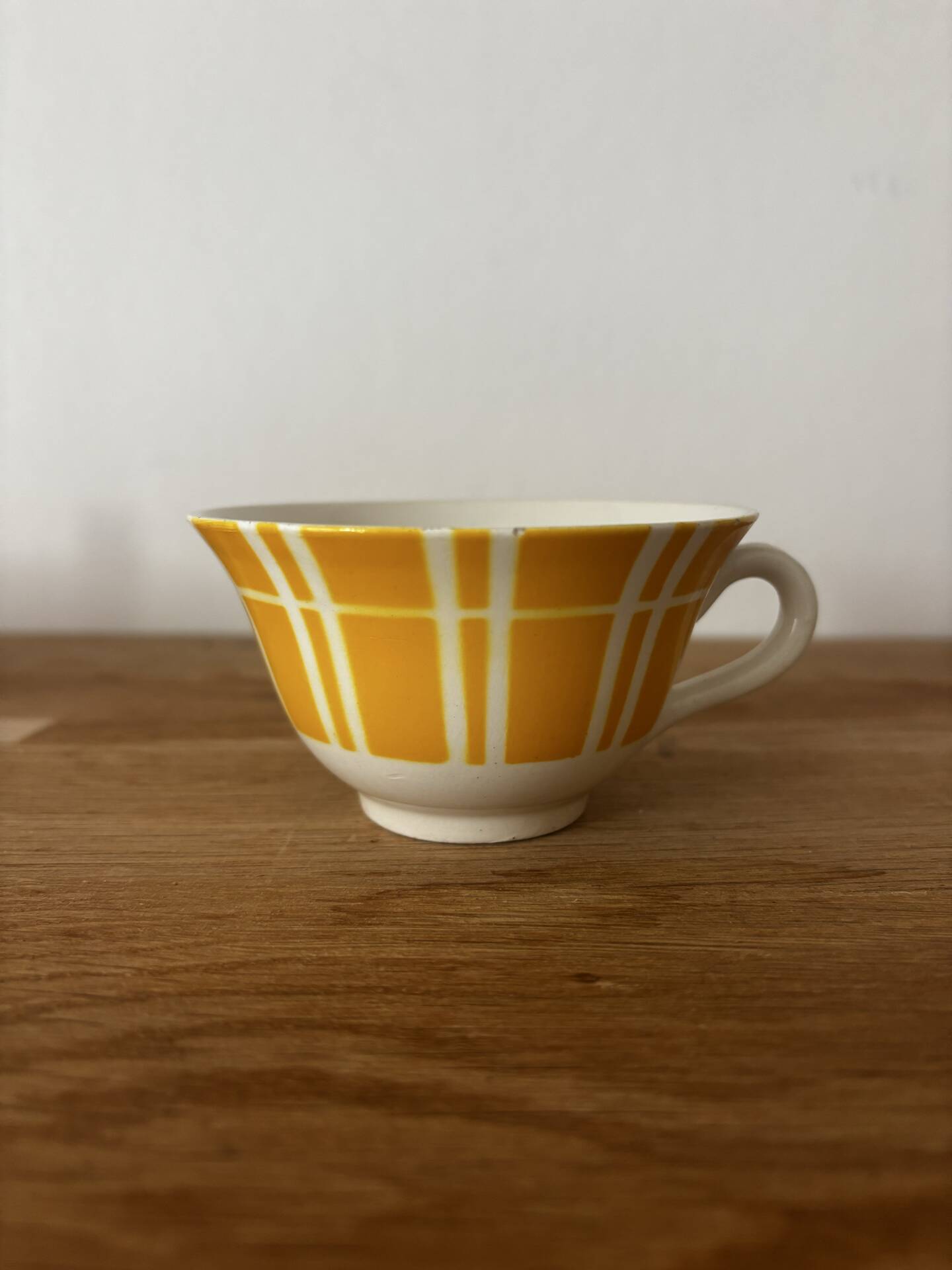 Set of two antique yellow Digoin Sarreguemines cups.