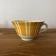 Set of two antique yellow Digoin Sarreguemines cups.