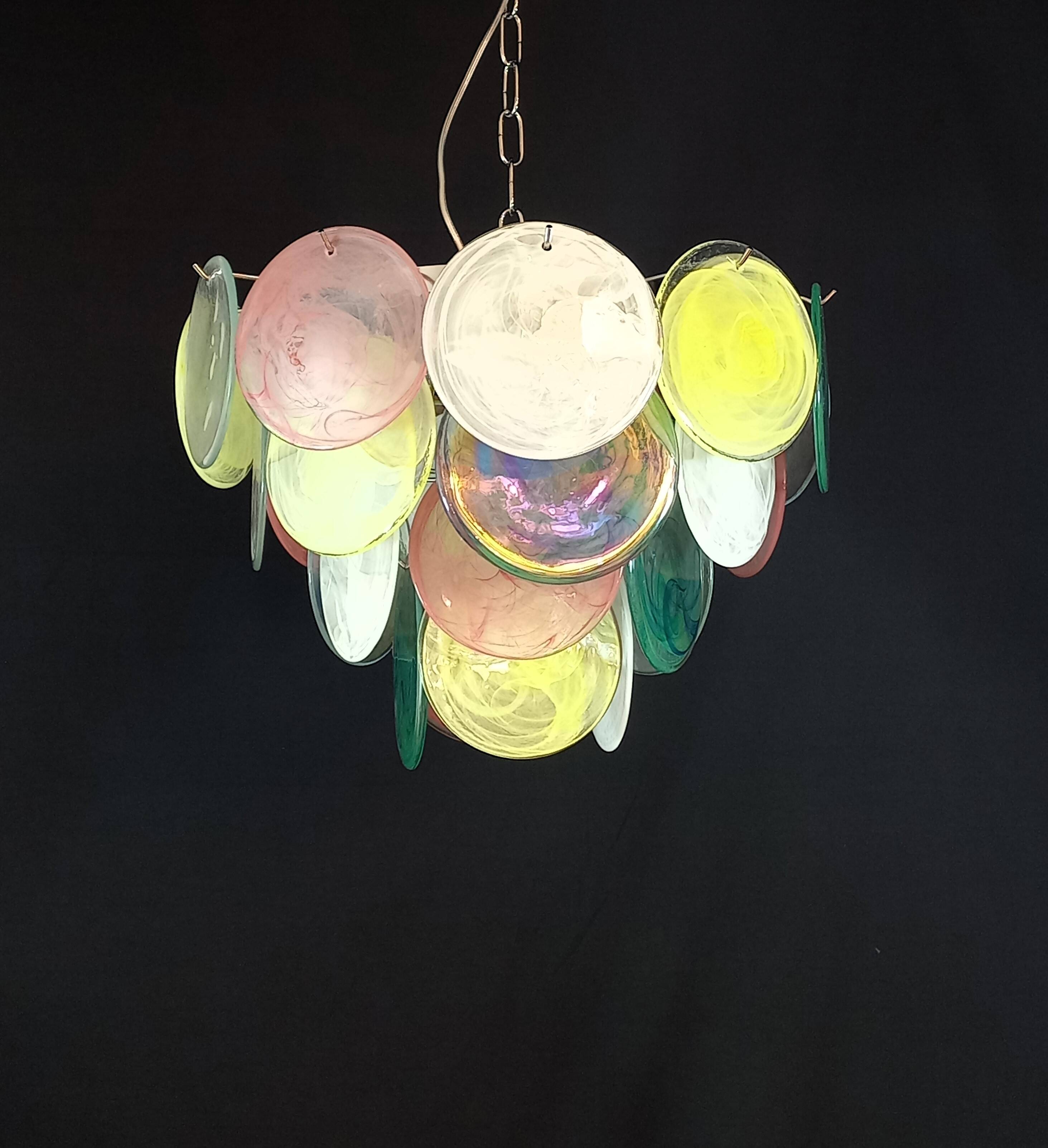 Handcrafted chandelier with Murano glass discs.