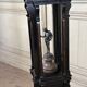 A pedestal table in blackened wood and burl veneer, superb assembly of moldings circa 1880