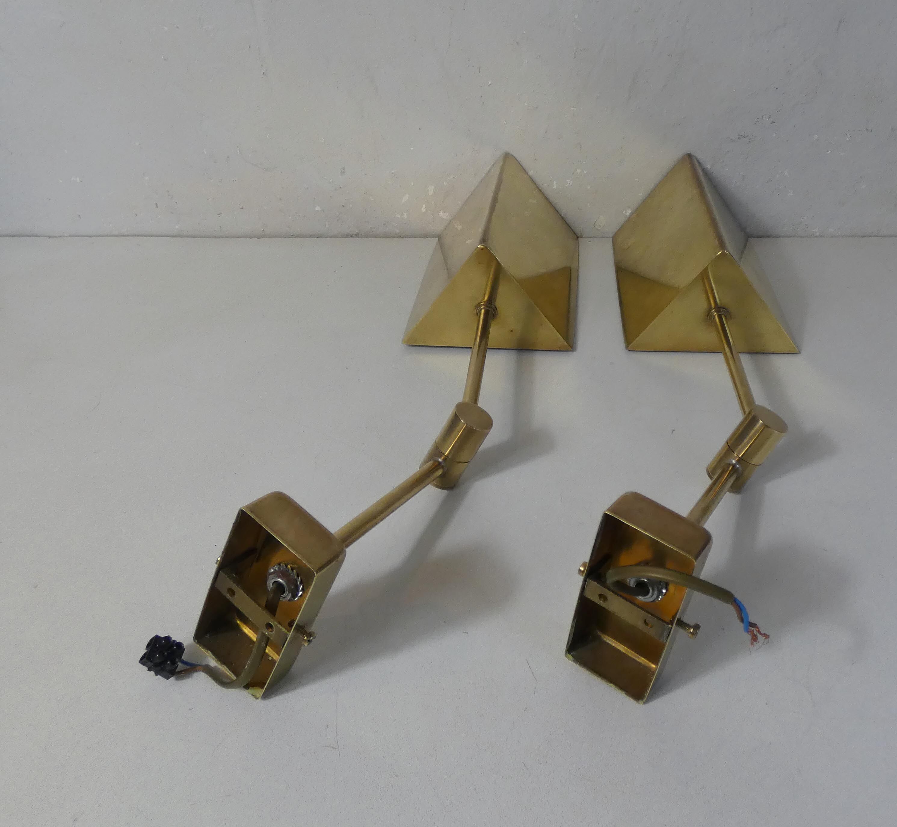 Pair of adjustable brass wall lamps after koch & lowy