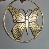 Brass trivet depicting a butterfly