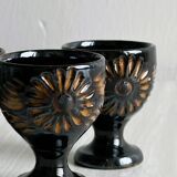 3 black ceramic egg cups, floral patterns
