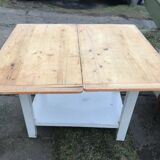 Vintage wooden kitchen table in orange and white with a drawer and low shelf.