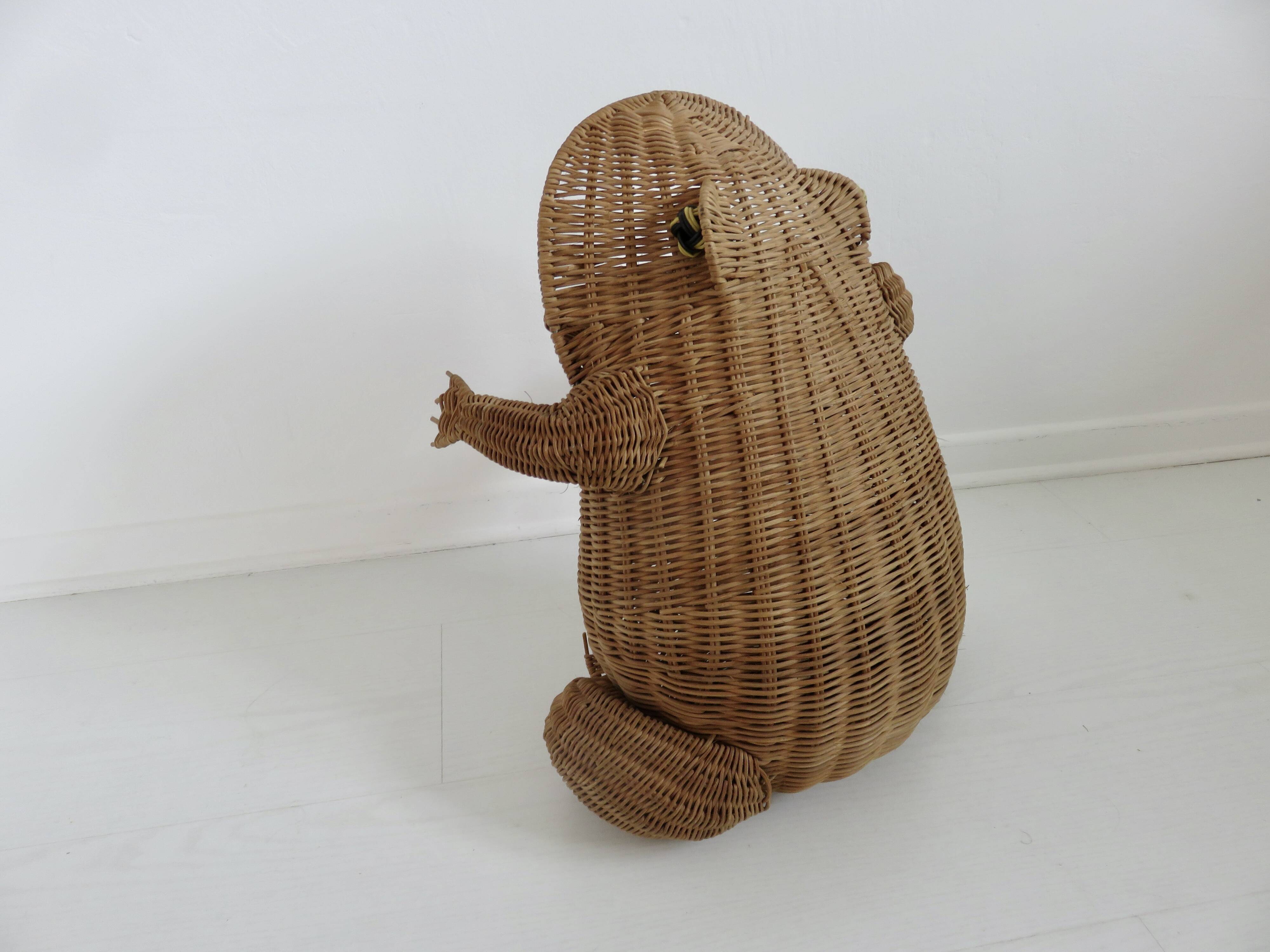 Magazine rack, design by Olivier Cajan, in wicker rattan, 1970s.
