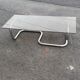 Table basse en acier chromé et verre fumé vers 1970