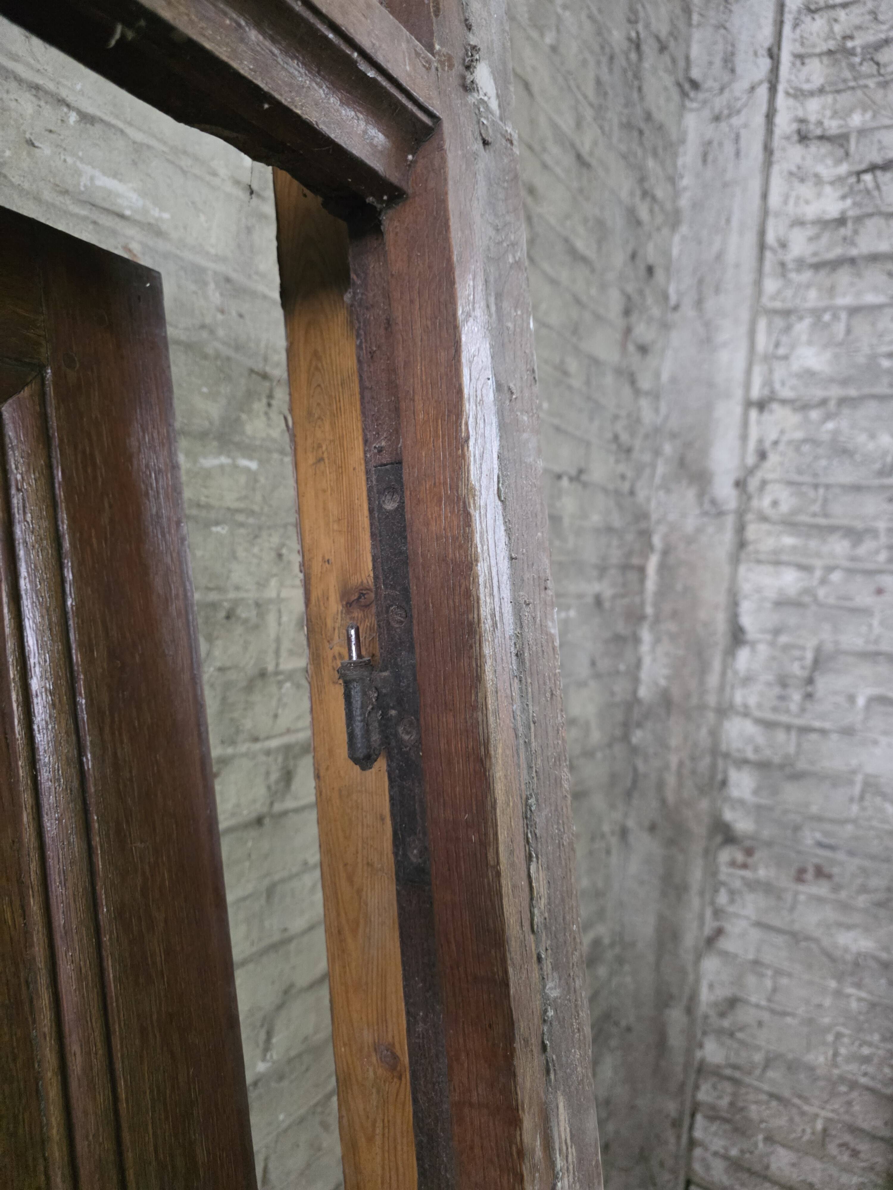 Old solid oak front door with frame and transom from the 19th century.