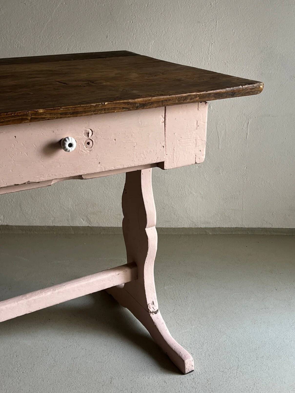 Rustic pink painted desk with brown tabletop