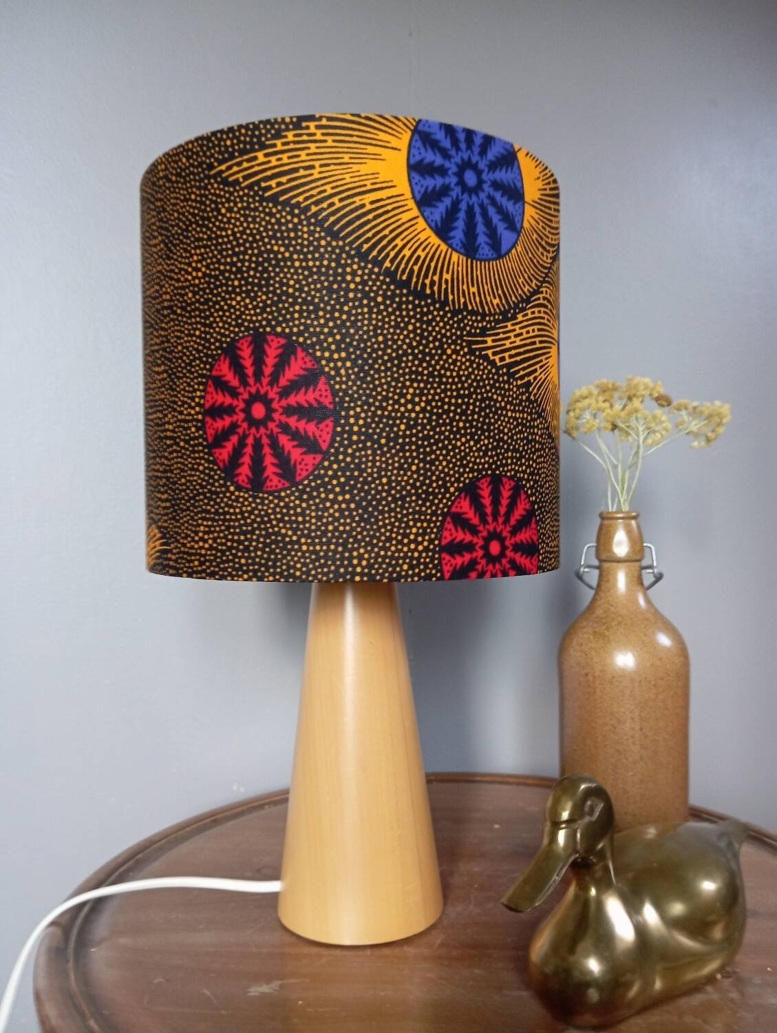 Table lamp in blond wood with handmade wax shade