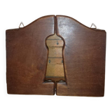 Old wooden key box cut out in the shape of a lock