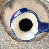 Vintage ceramic pitcher with geometric patterns