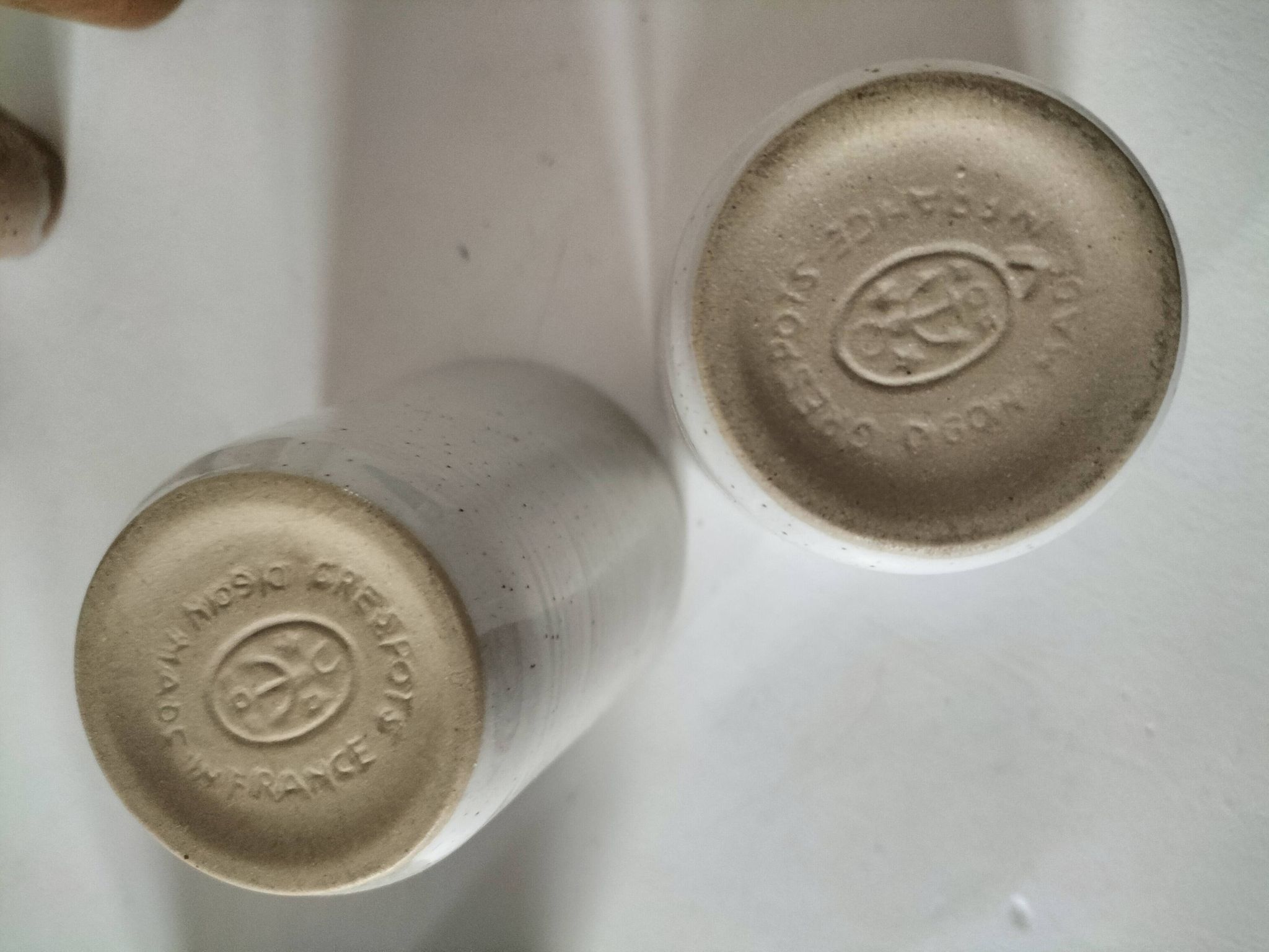 Set of 8 stoneware cups and a mug, shades of beige.