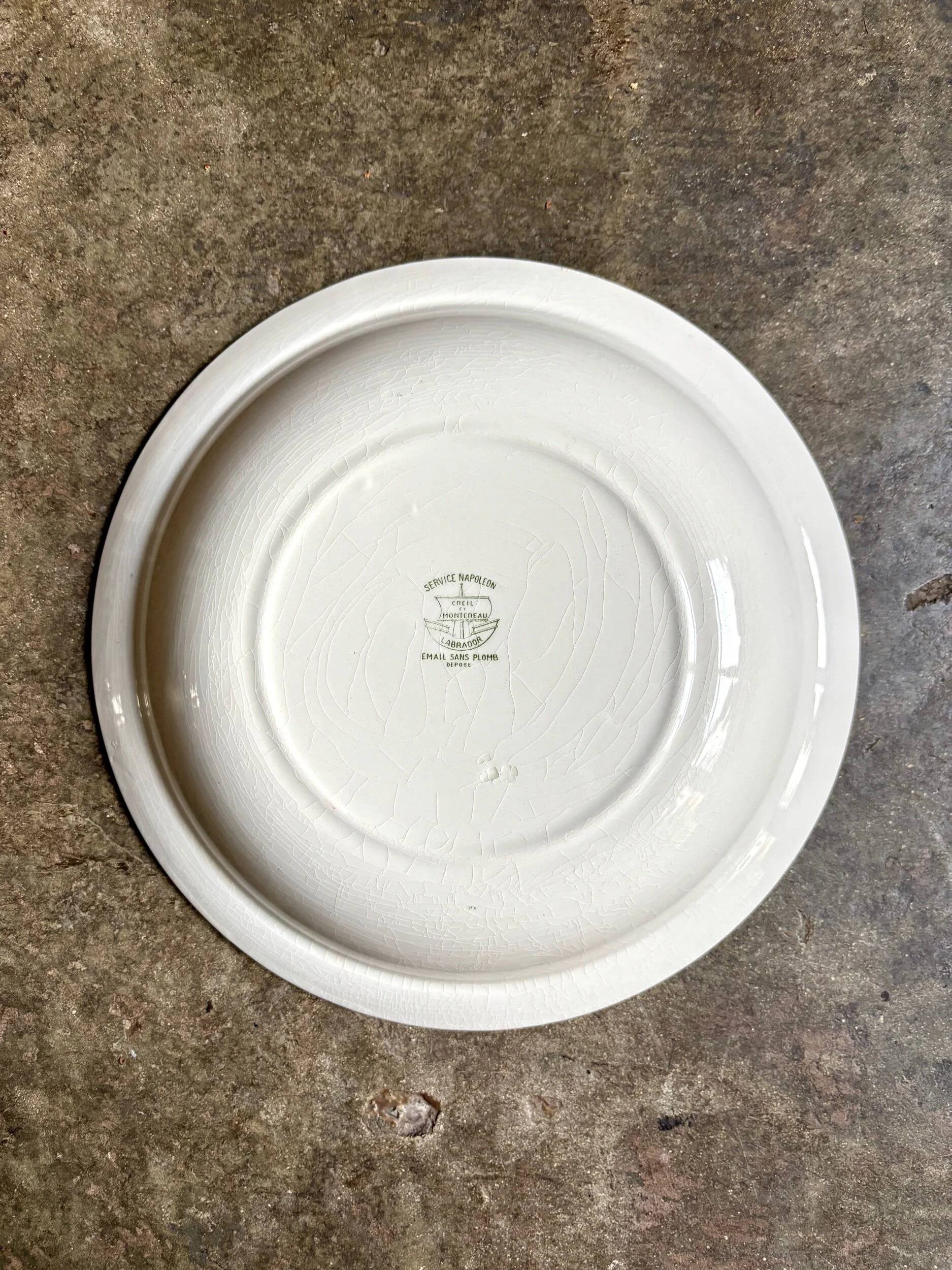 Round, deep Creil & Montereau dish in green earthenware, "Napoleon" service