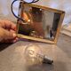 Pair of wall lights with hanging glass pendants in gold color