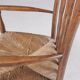 1930s small low spindle-back hearth chair / side chair with wicker seat, Arts & Craft Movement, Morris & Co for Liberty and Co, Stowaway London