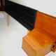 Mid century 1970s retro teak headboard with two hinged bedsides, upholstered in black by 'slumberlan