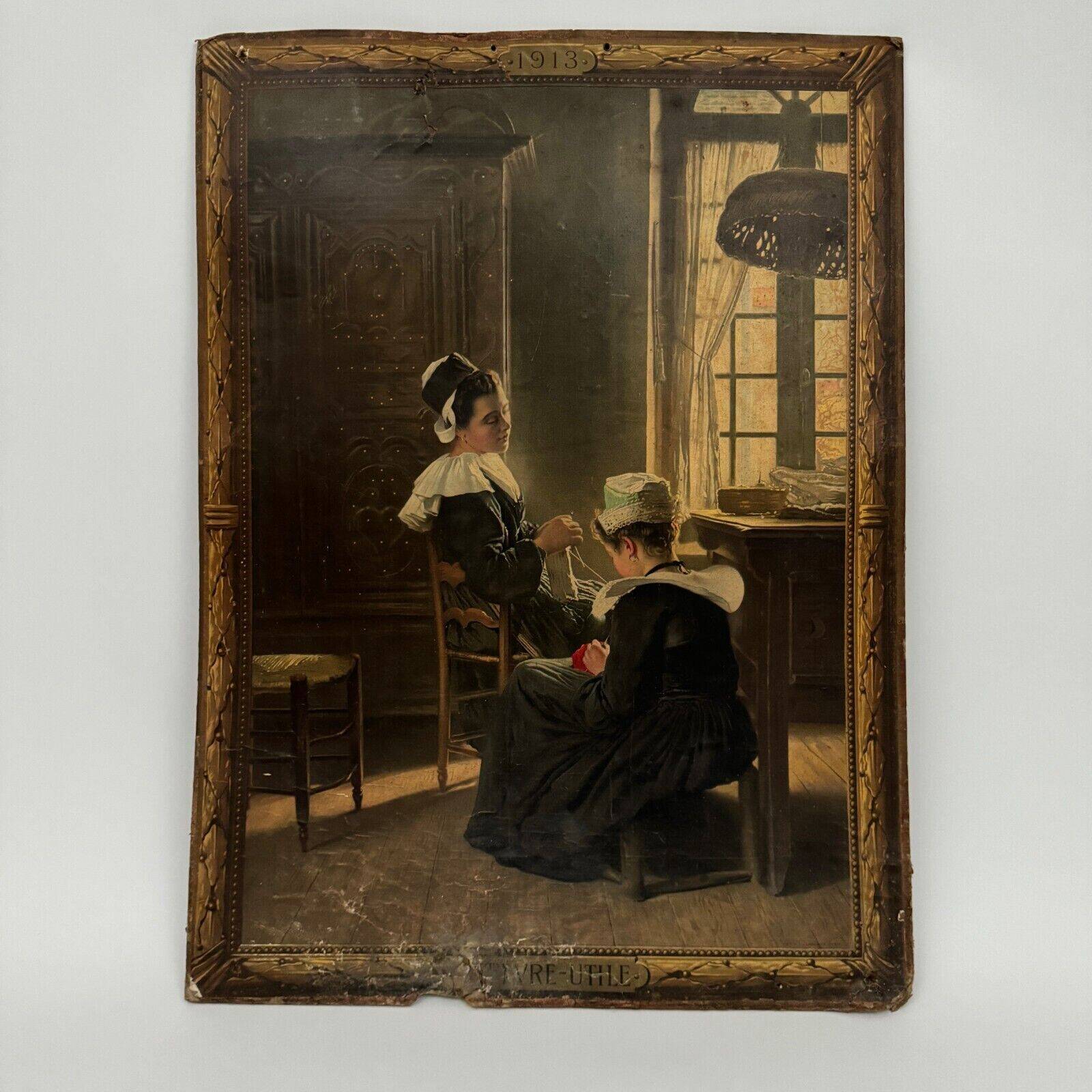 Sign read on cardboard illustrated with two Breton women in costume