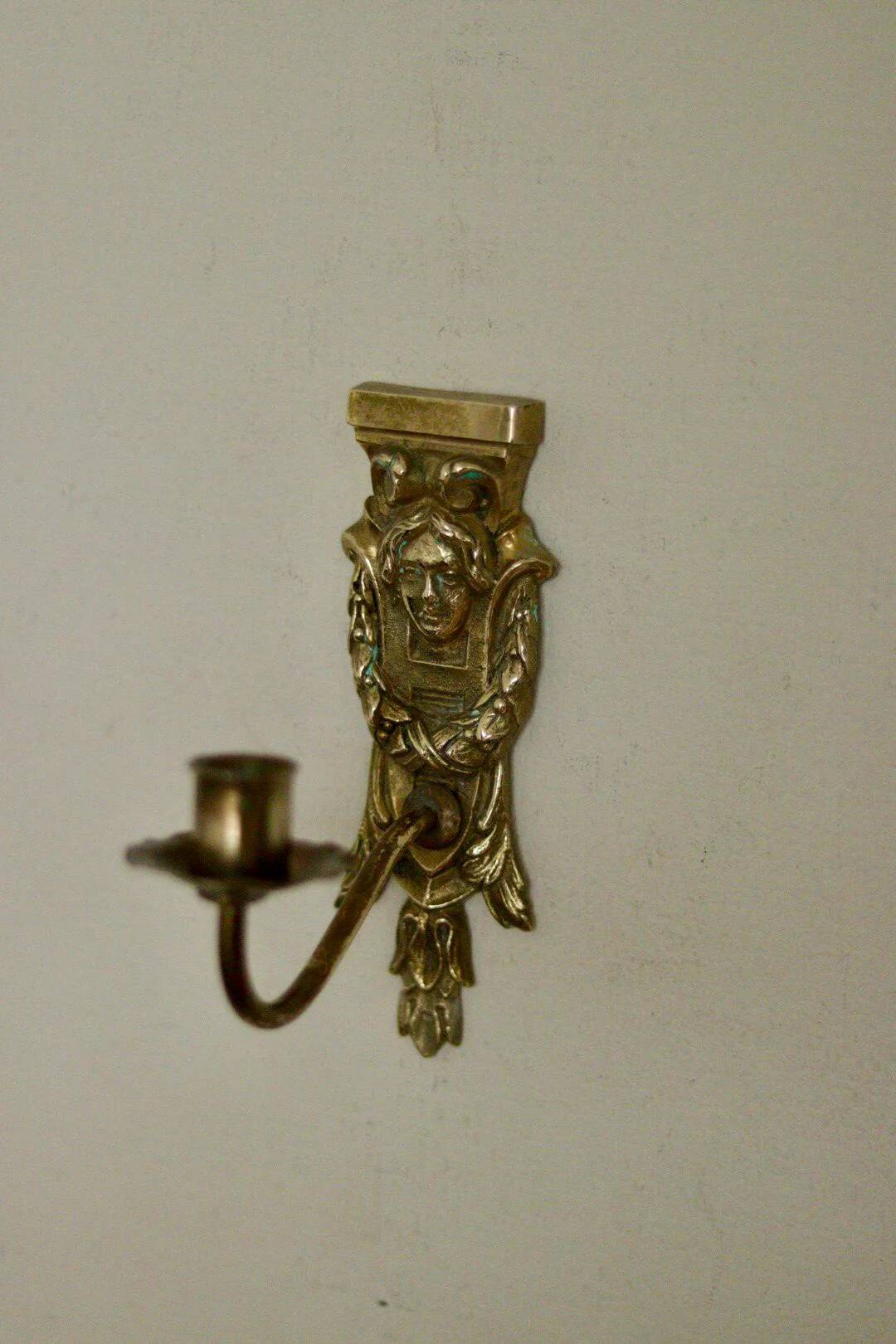 Pair of mid-century Swedish brass face motif sconces