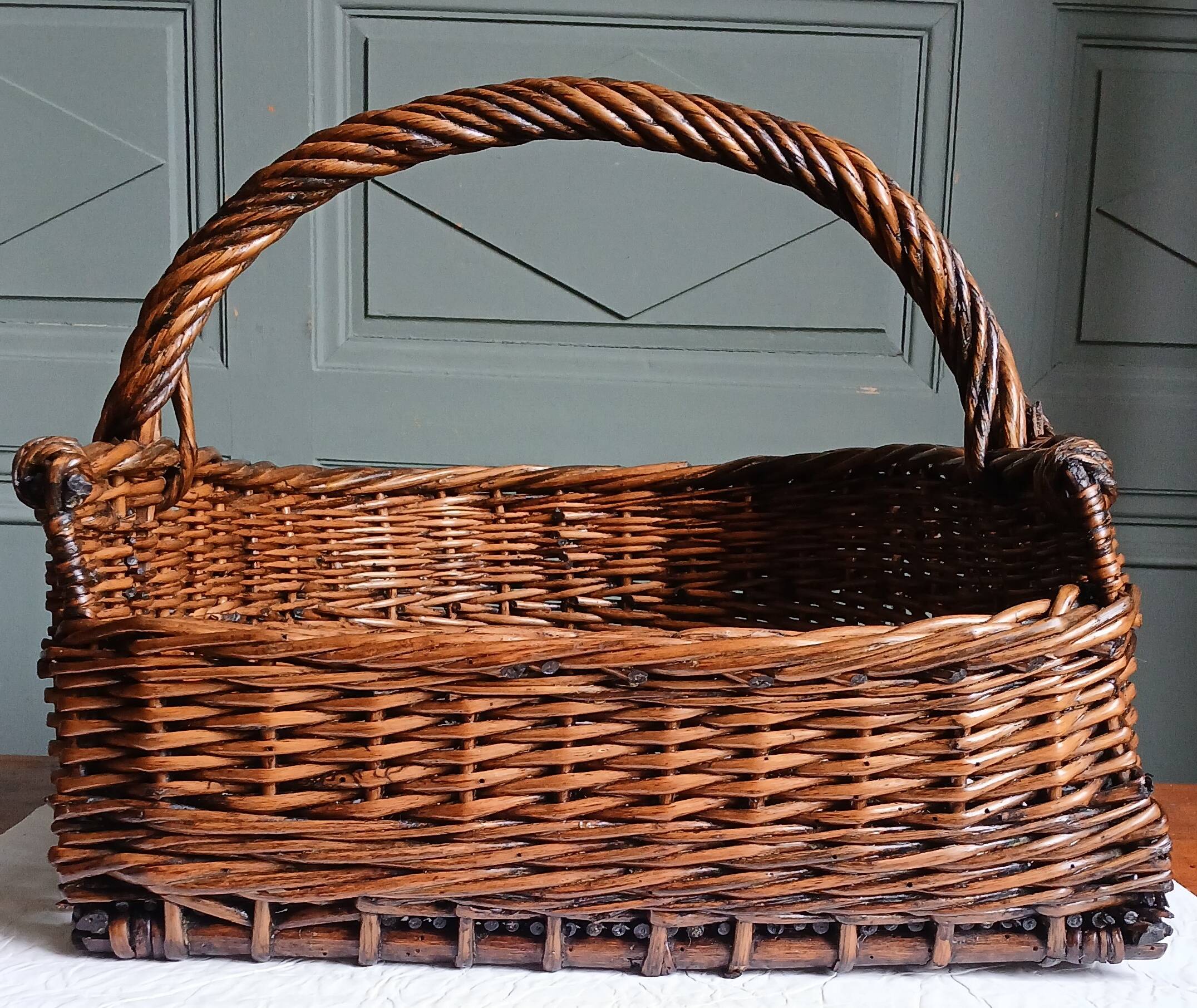 Handmade woven and dyed willow harvest basket.