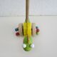Push toy, wooden dinosaur. Brand: Bino