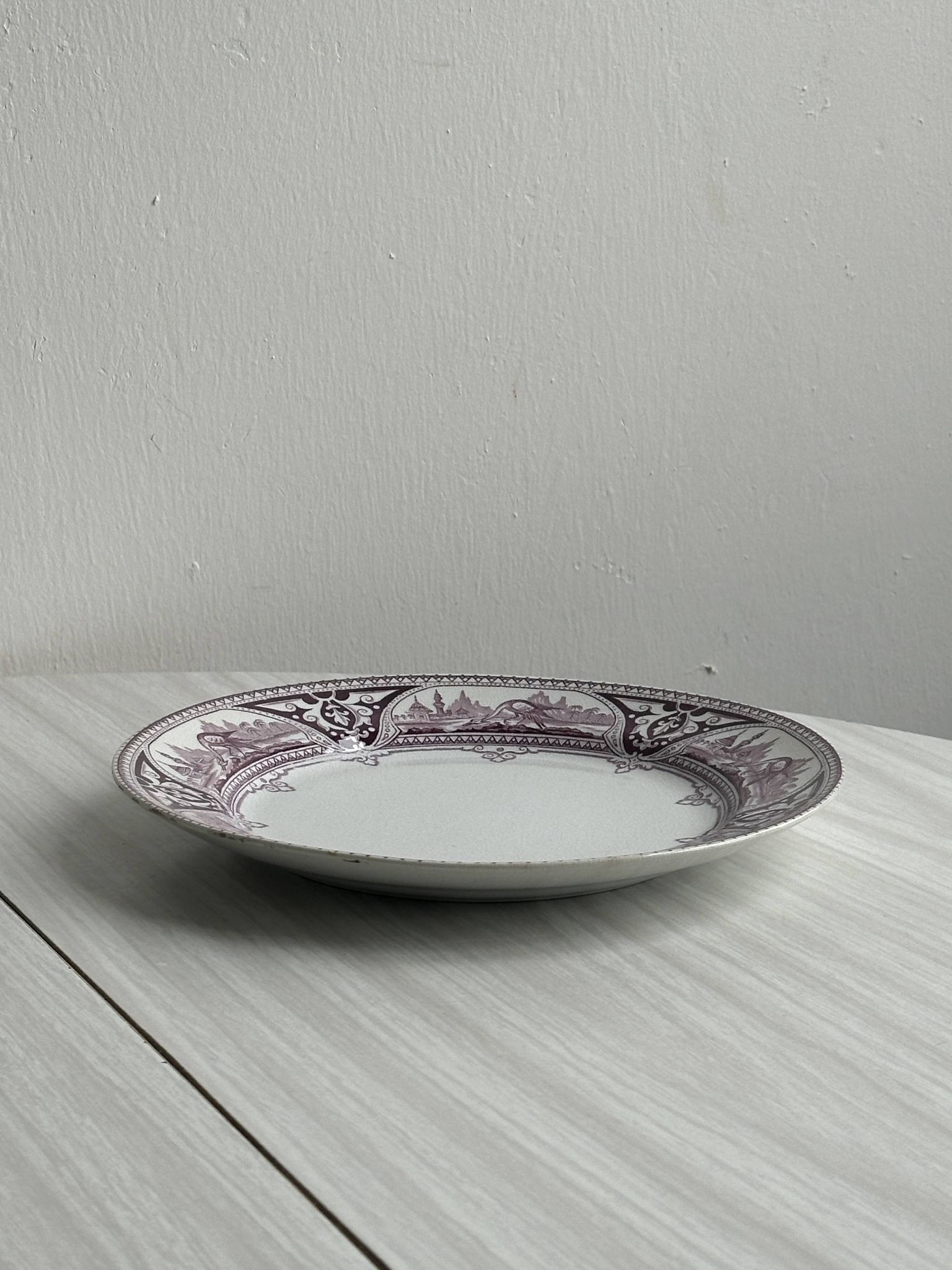 Antique plate with purple oriental decoration