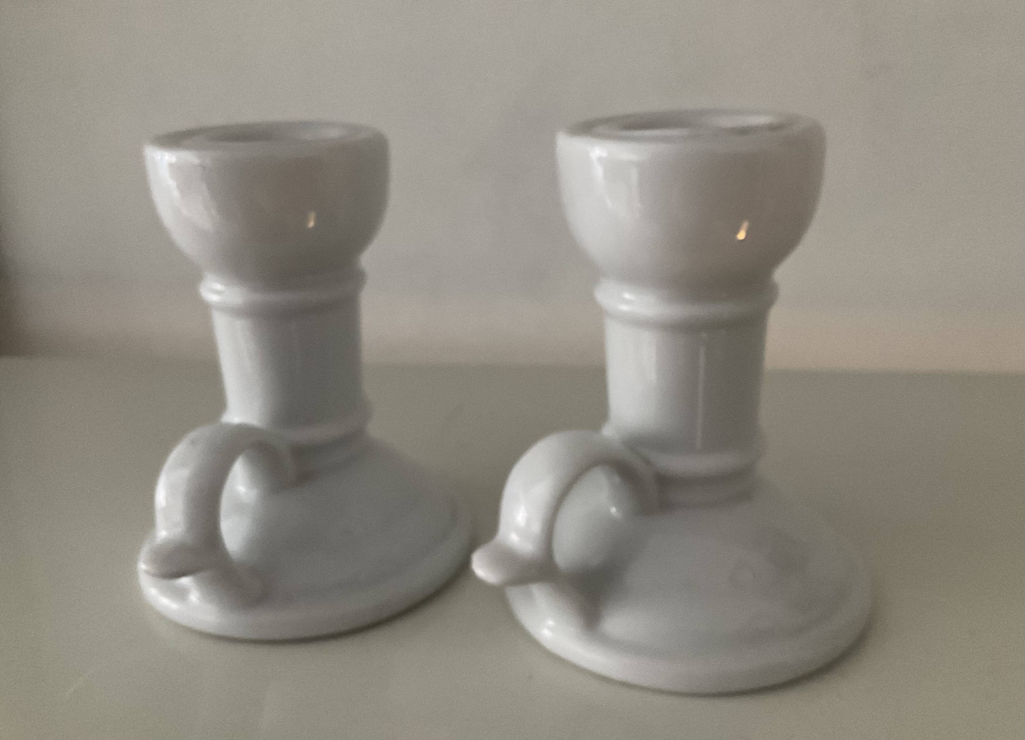 Pair of vintage cellar rat porcelain candlesticks