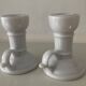 Pair of vintage cellar rat porcelain candlesticks