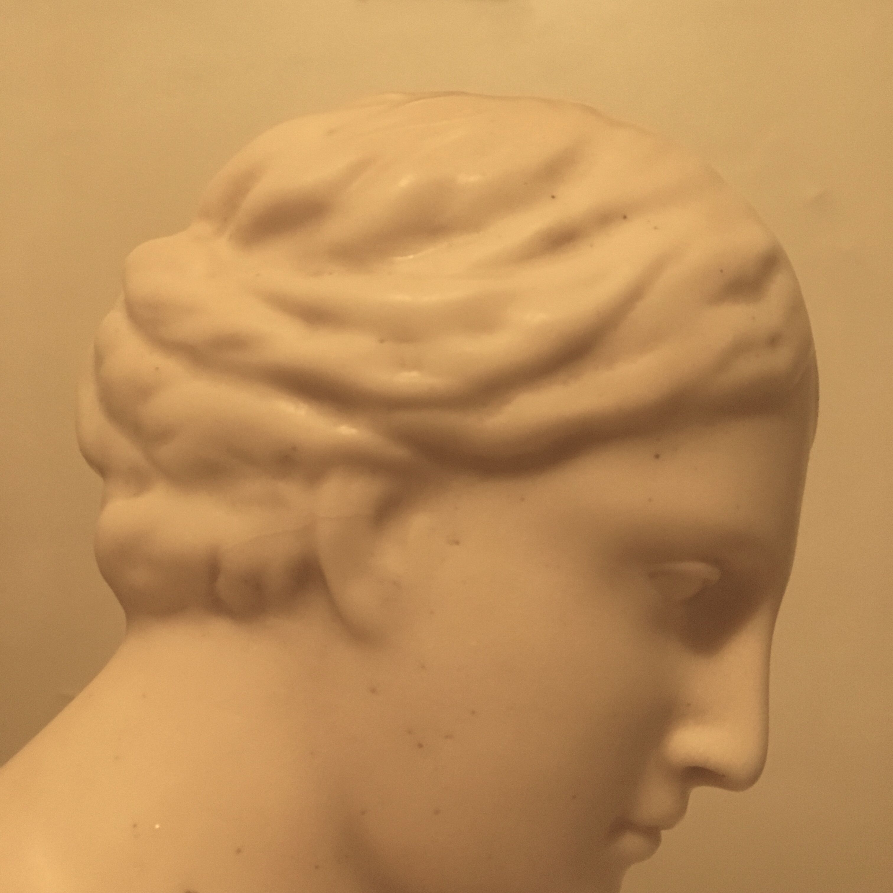 Bust of woman in off-white biscuit