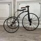 Children's tricycle made of wrought iron, around 1900.