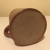 Small pitcher in patinated sandstone