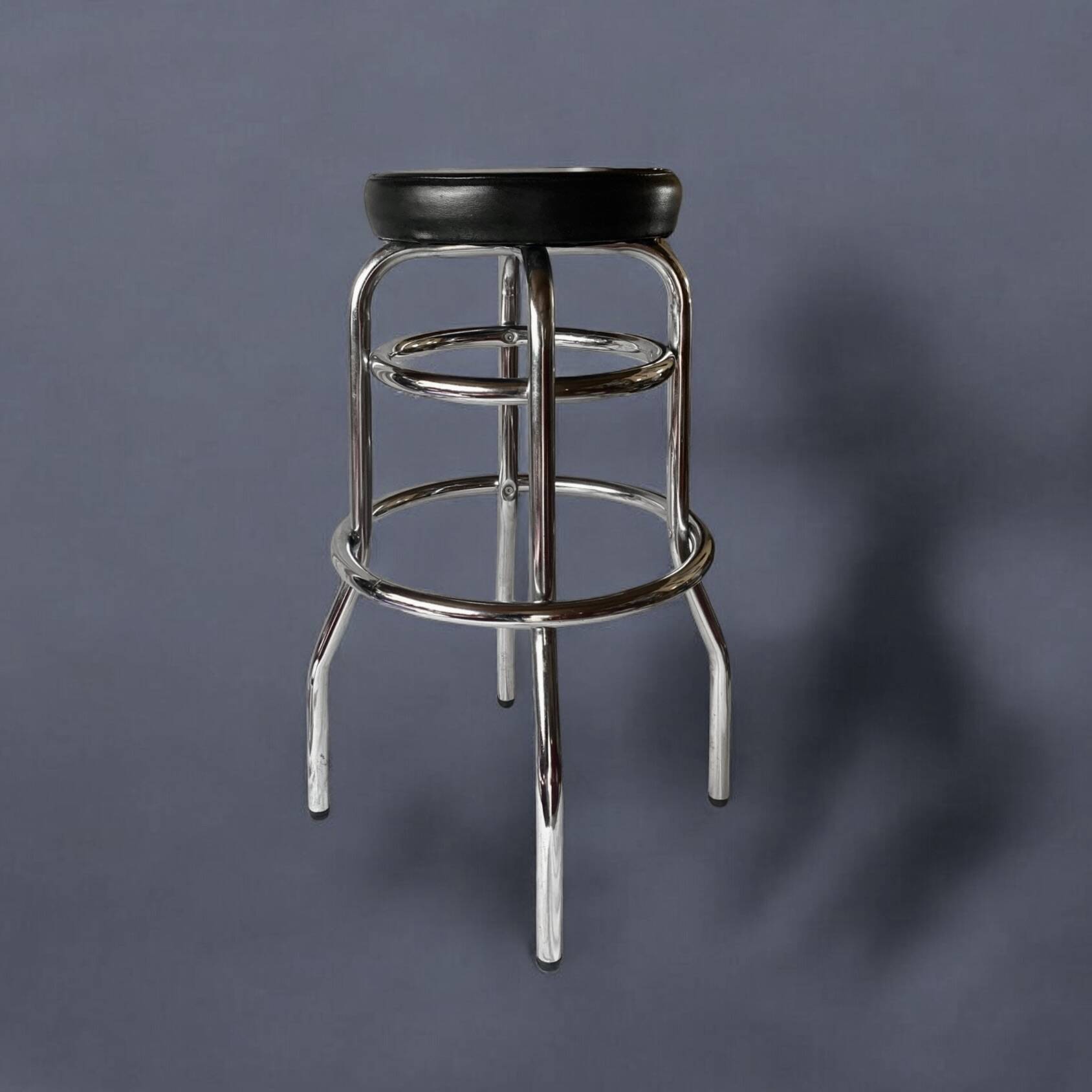 Vintage bar stool in black skai and chrome metal