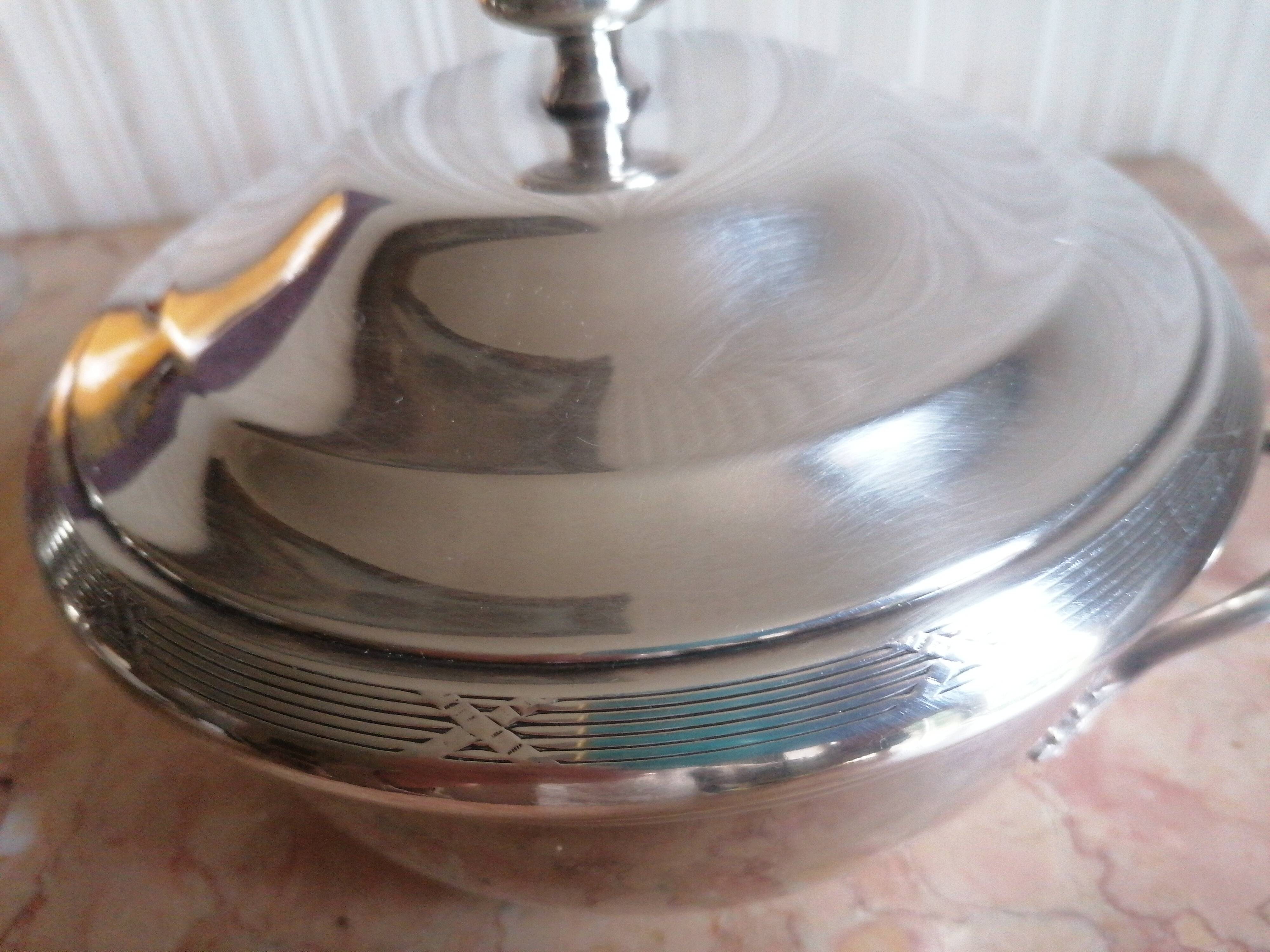 silver metal vegetable dish with crossed ribbon decoration