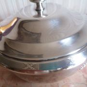 silver metal vegetable dish with crossed ribbon decoration