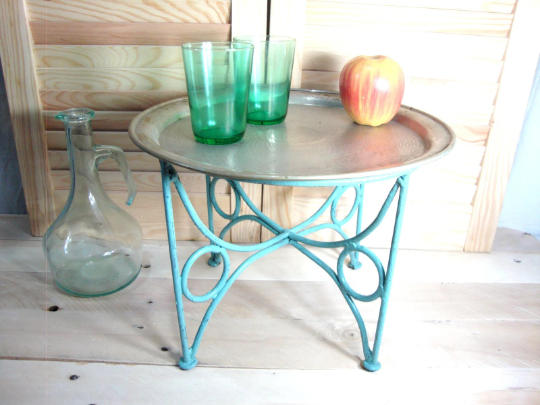 Small metal coffee table or plant stand.