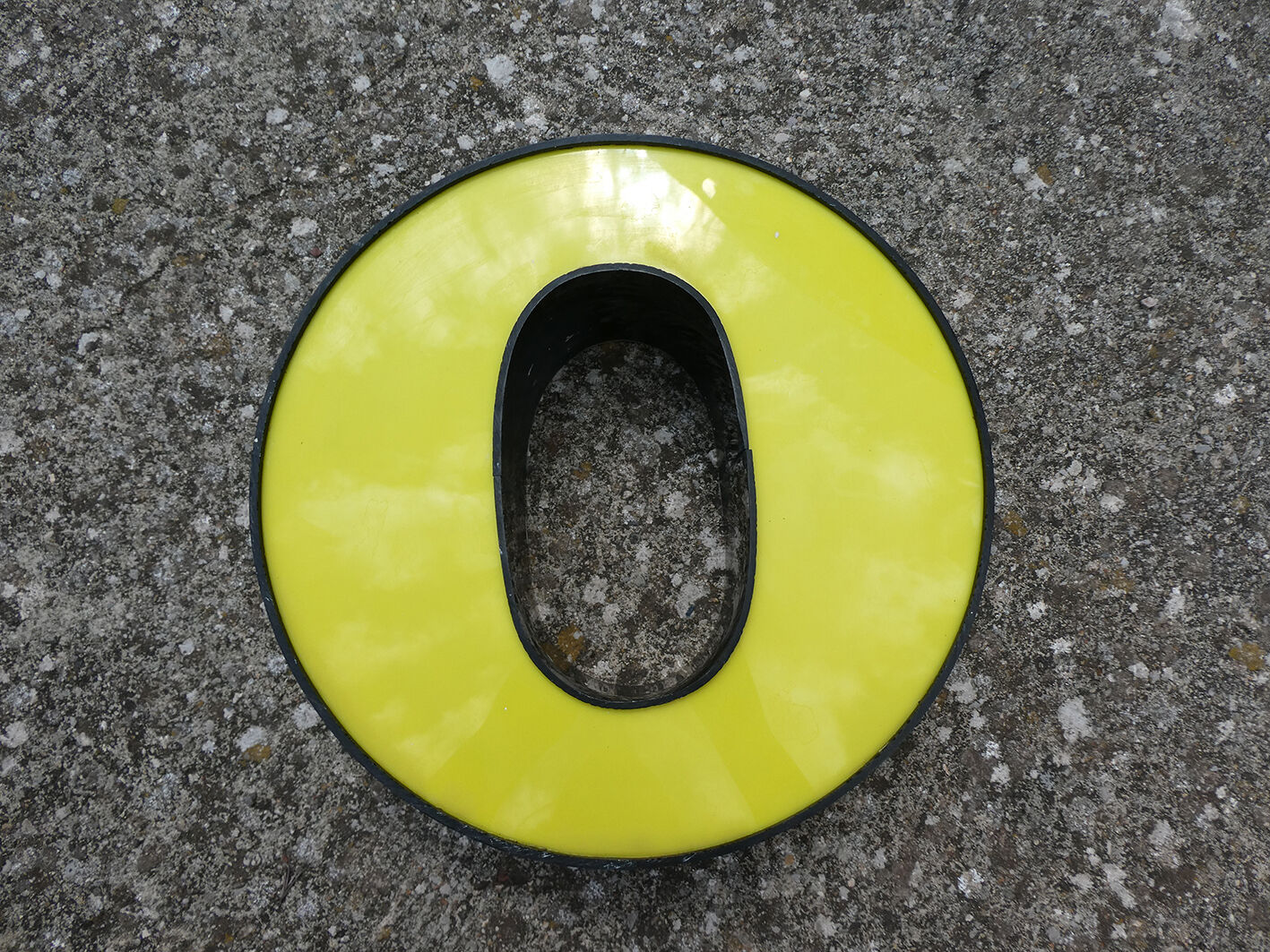 Letter "O" of industrial sign yellow and black