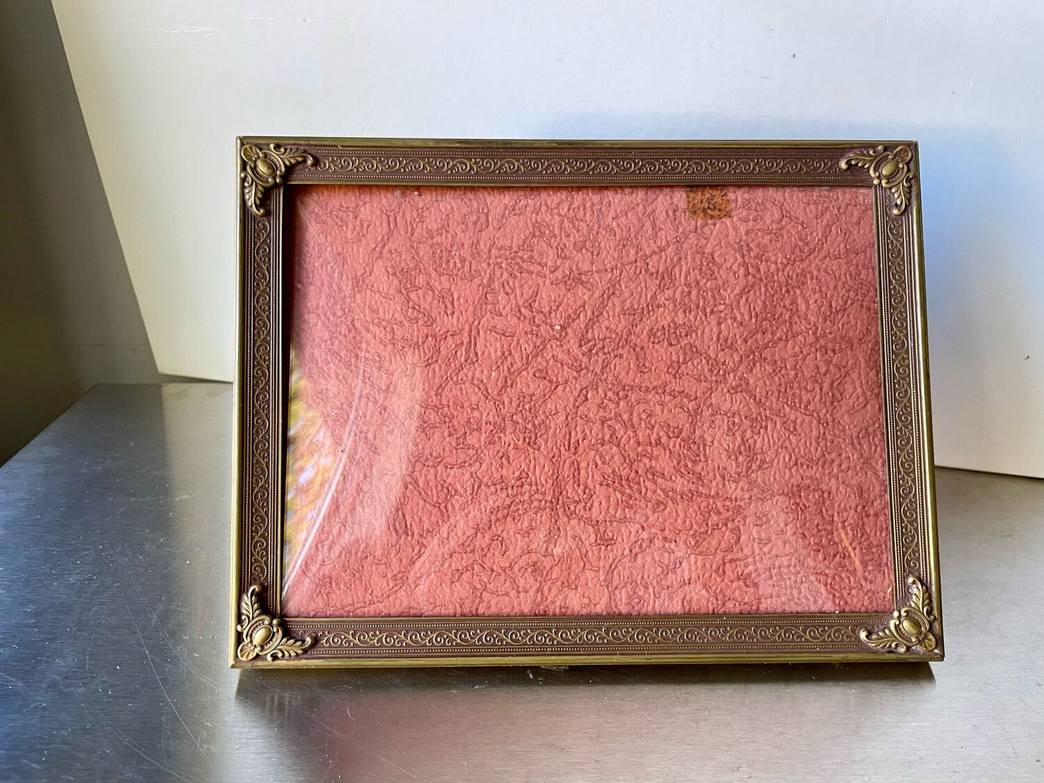 Metal frame in gold colored brass