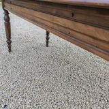Old French farmhouse table in walnut with turned legs.