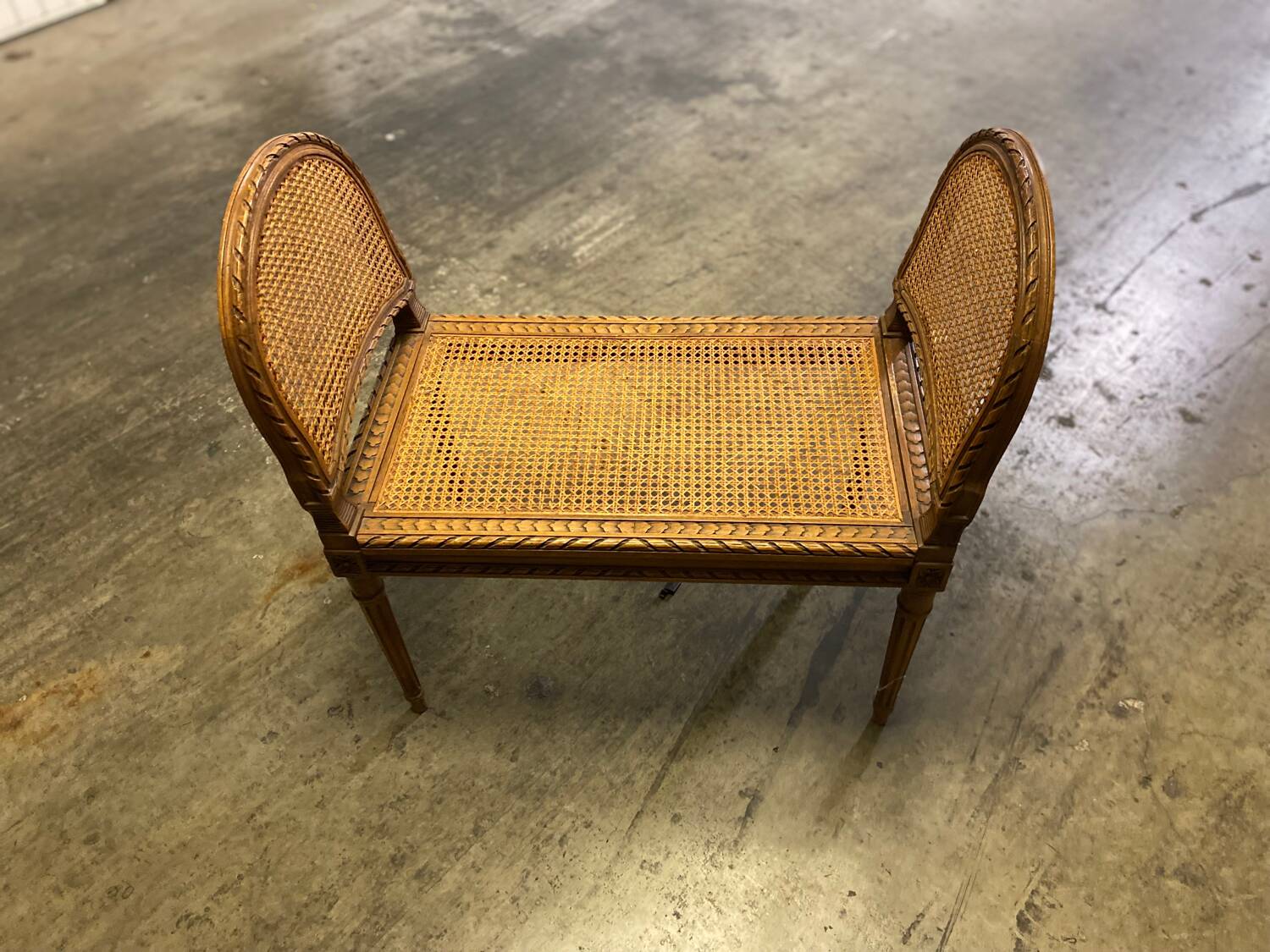 Wooden and cane bench (piano bench)