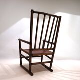 Manou rattan armchair with leather seat, 1960