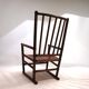 Fauteuil Manou en rotin et assise en cuir, 1960