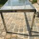Table verre inox et laiton