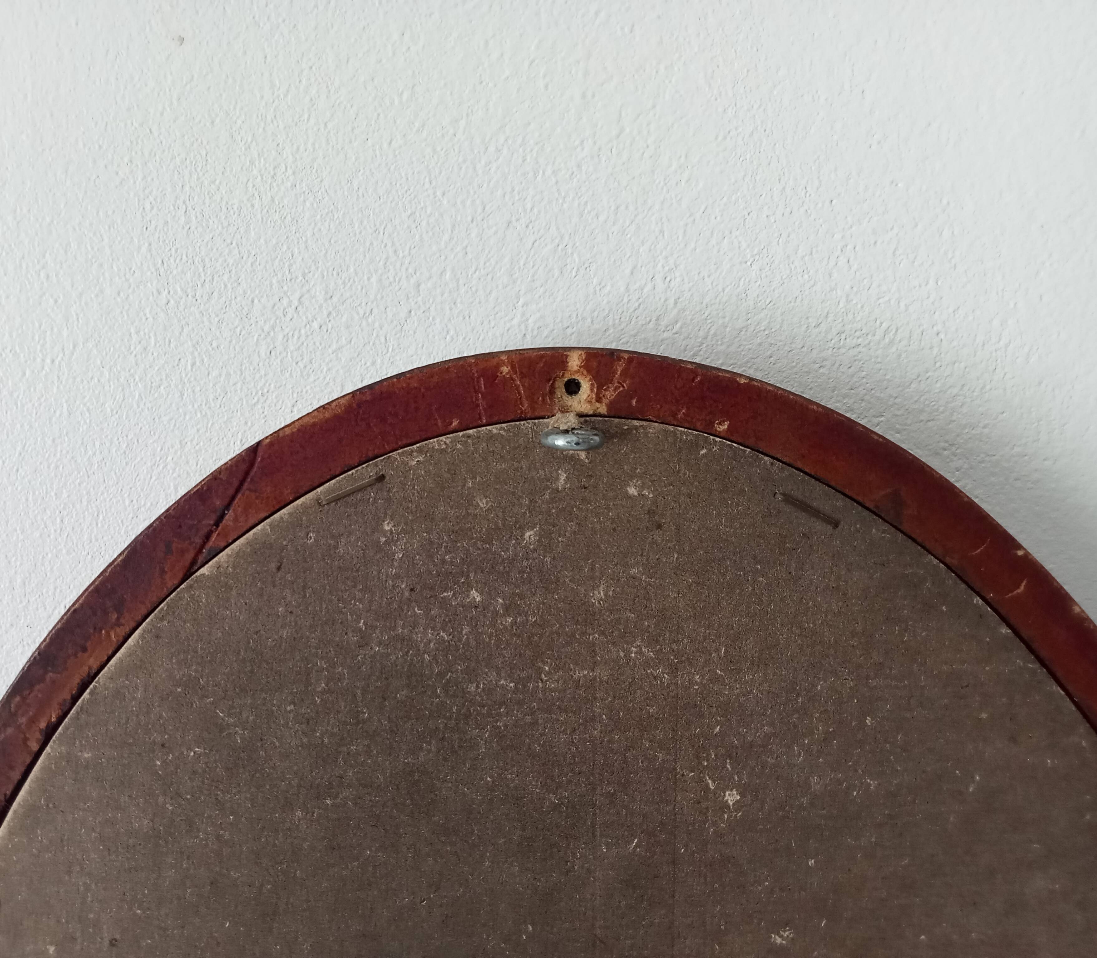 Vintage oval wooden mirror "caramel" from the 1960s.