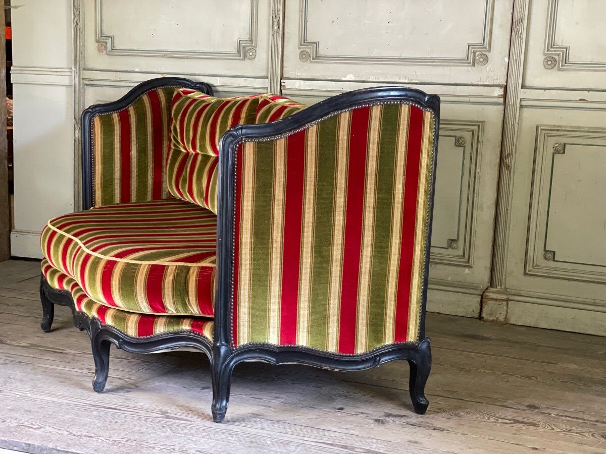 Louis XV style sofa in carved wood with a black patina