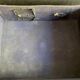 Small black grained leather travel suitcase from the 1920s