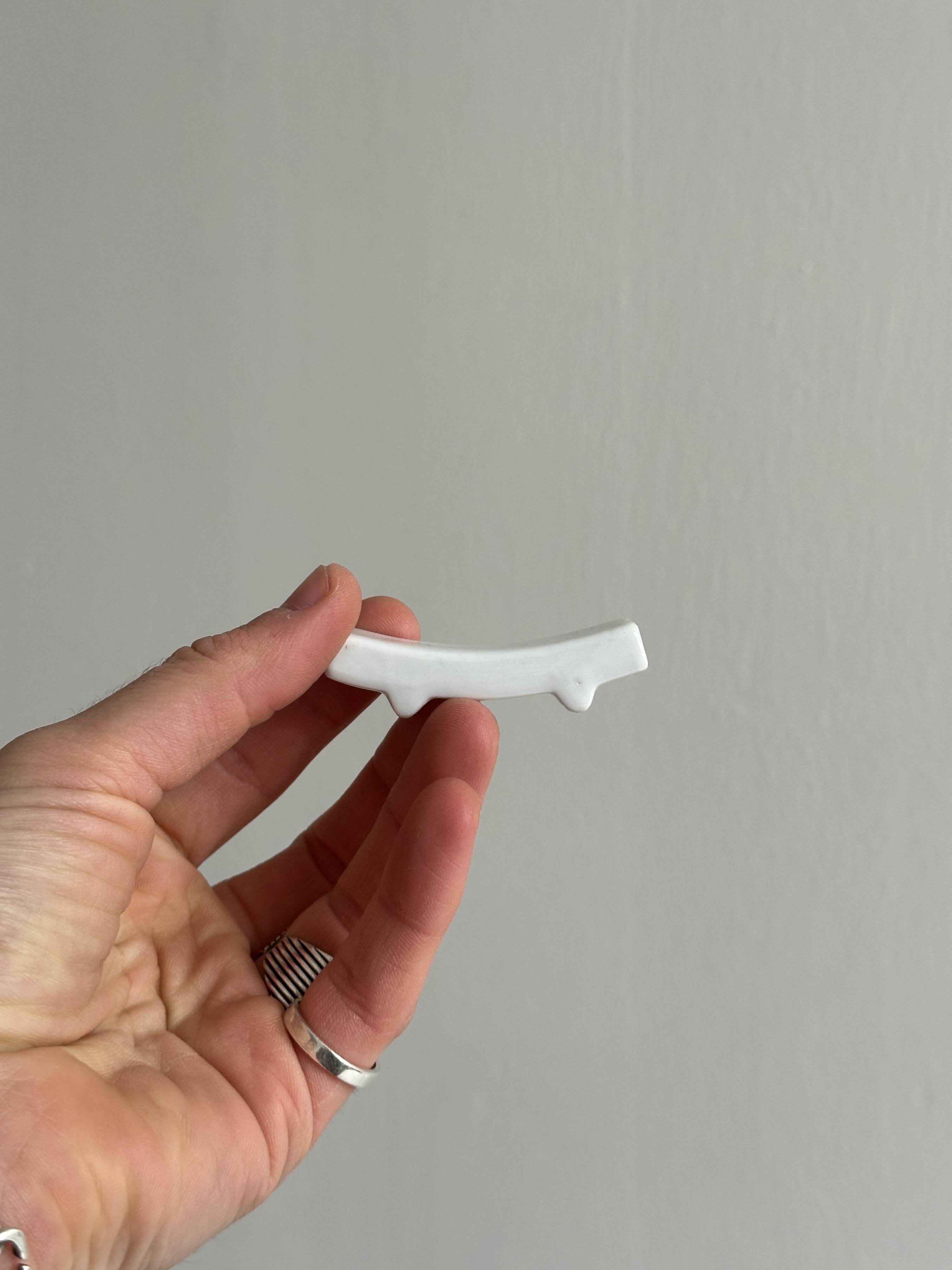 Set of white porcelain chopstick holders