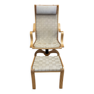 Swivel armchair and its Scandinavian design ottoman.