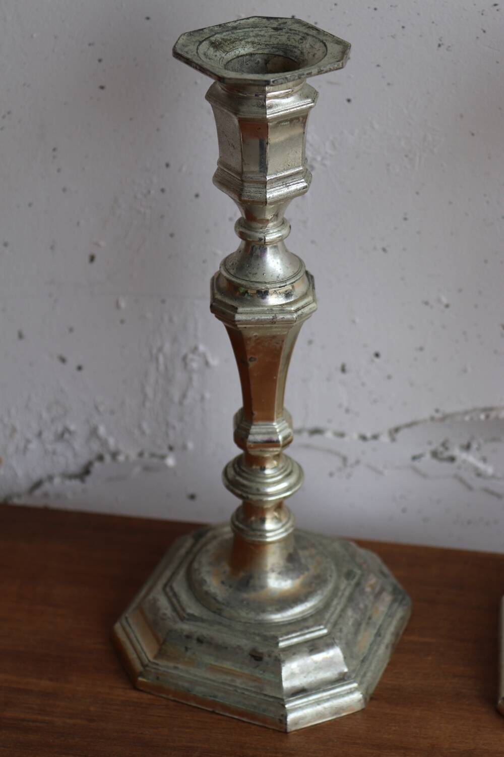 Pair of antique silver-plated metal candlesticks