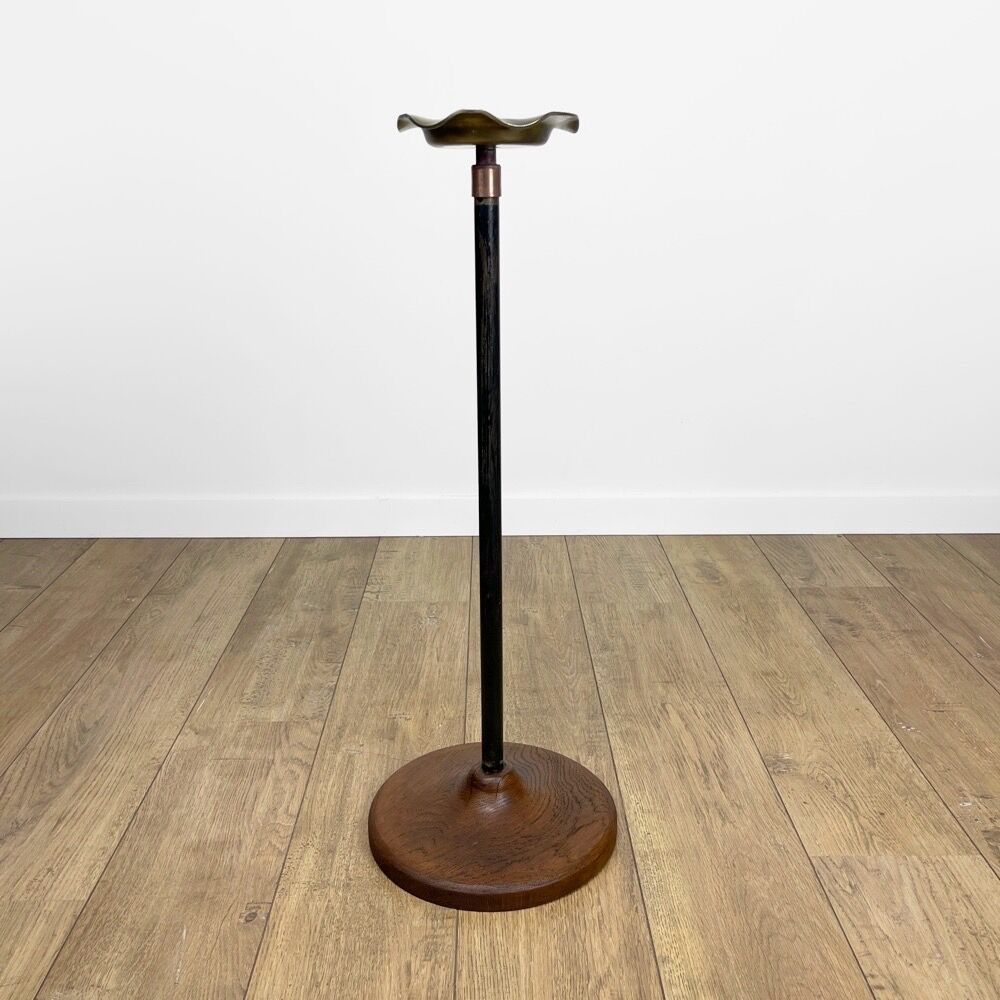 Brass ashtray on metal stand and wooden base