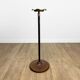 Brass ashtray on metal stand and wooden base