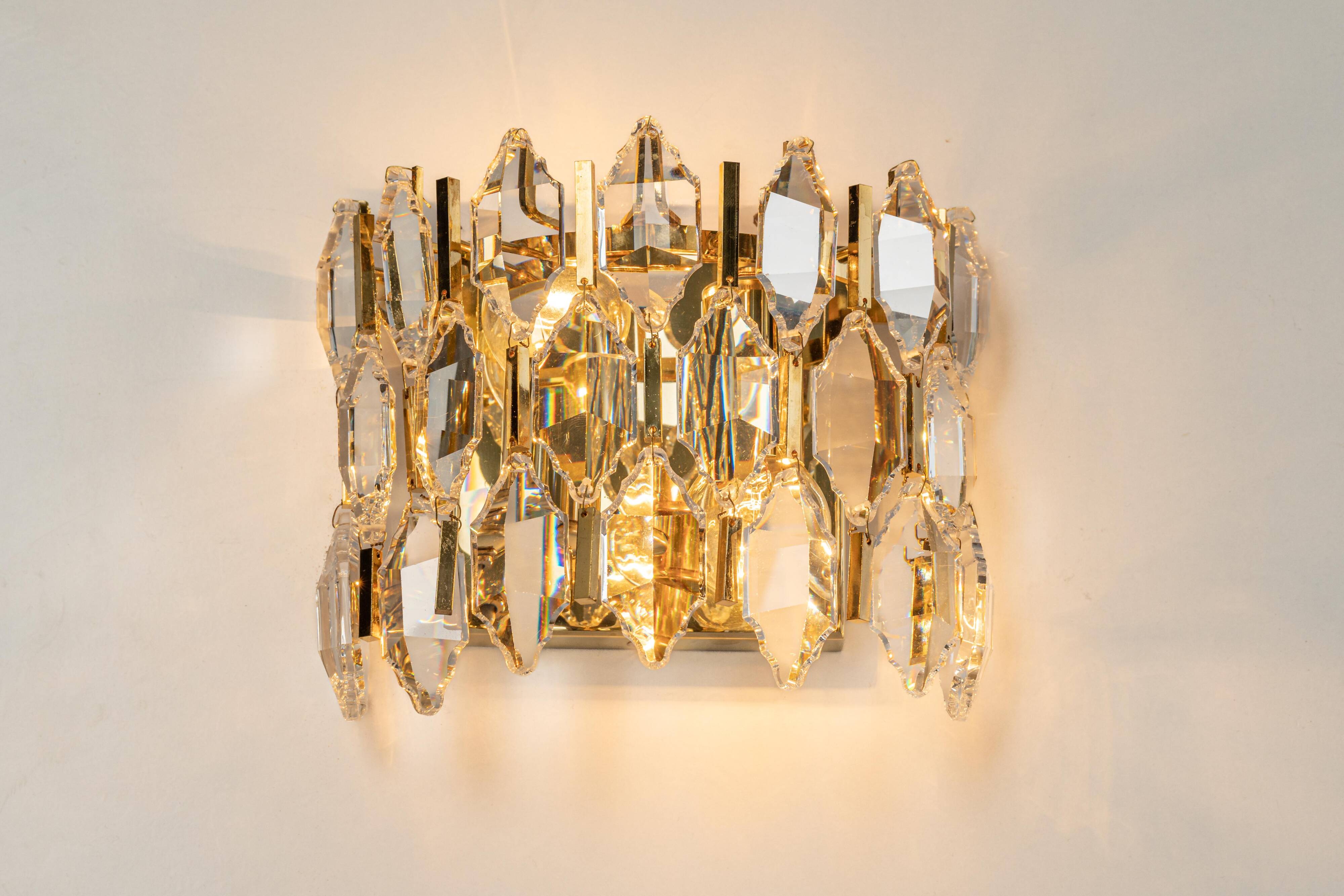 Pair of wall sconces in gilded brass and crystal by Palwa, Germany, 1970s.